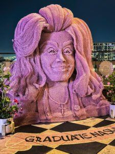 Pink Dolly Parton statue on the rooftop of The Graduate Nashville hotel